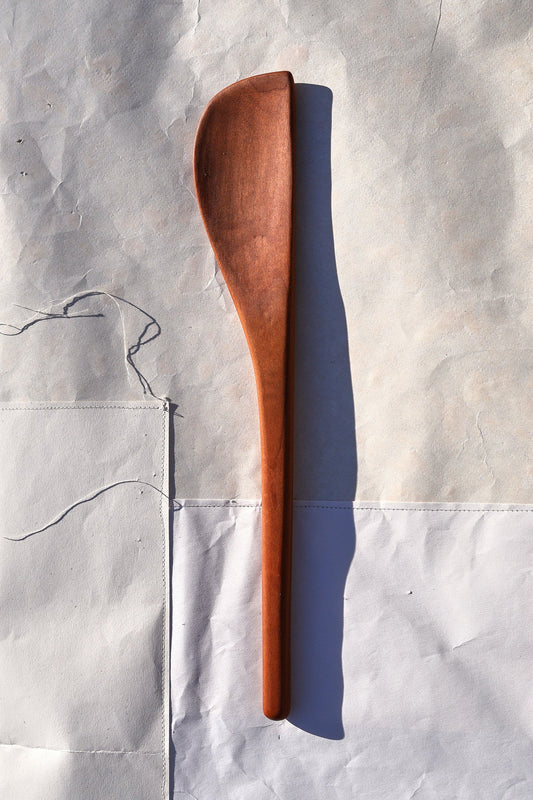 Wooden spoon on a textured gray background